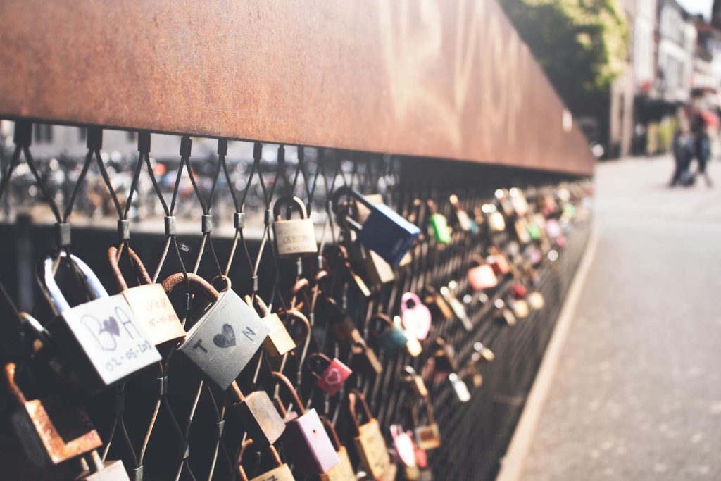 Numerous locks placed by couples, symbolizing commitment and the strength of long-term relationships.